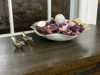 Vibhsa silver bird figurines set of 2 in front of a decorative bowl of purple potpourri on Tampa Home & Garden Store