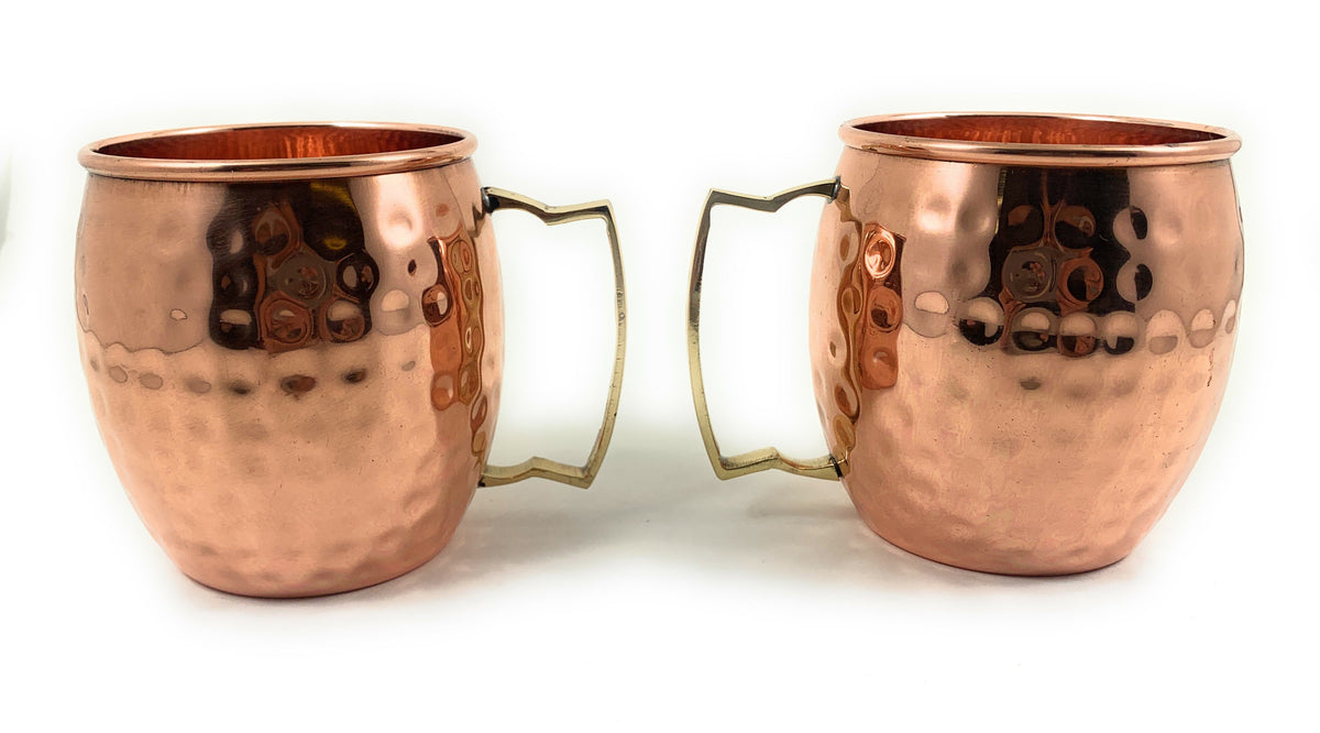 Vibhsa handcrafted copper Moscow Mule mugs, hammered finish with brass handles, 2 mugs shown on Tampa Home & Garden Store