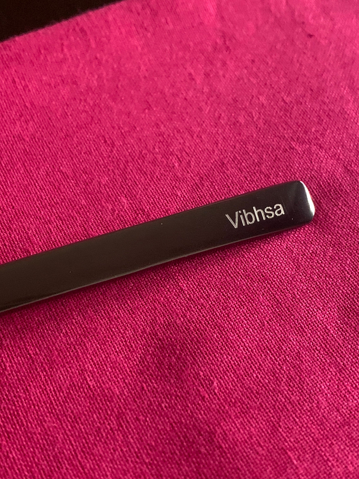 Vibhsa black dinner fork with visible branding on magenta fabric on Tampa Home & Garden Store