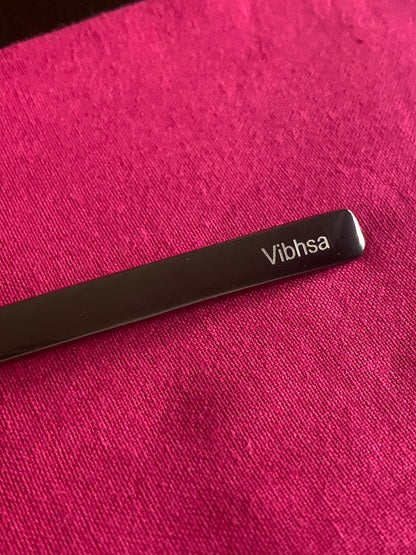 Vibhsa black dinner fork with visible branding on magenta fabric on Tampa Home & Garden Store