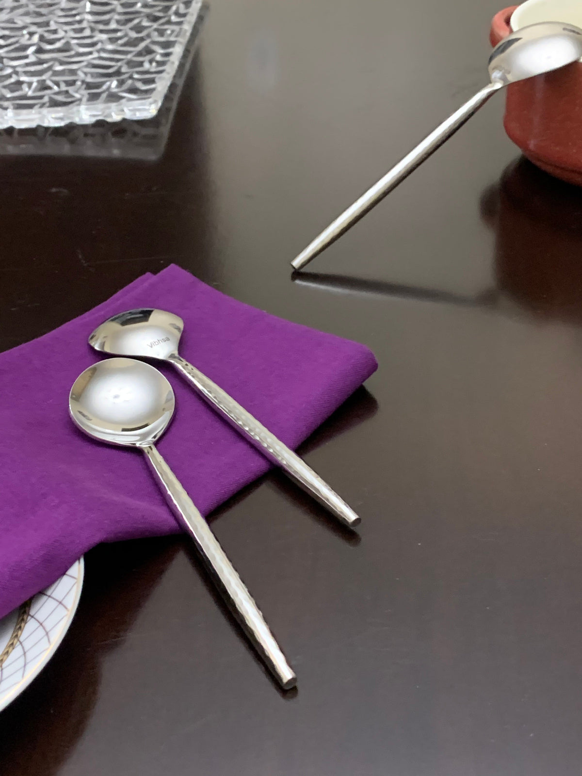 Vibhsa soup spoons set of 6, polished silver-tone utensils with long handles on a purple napkin on Tampa Home & Garden Store