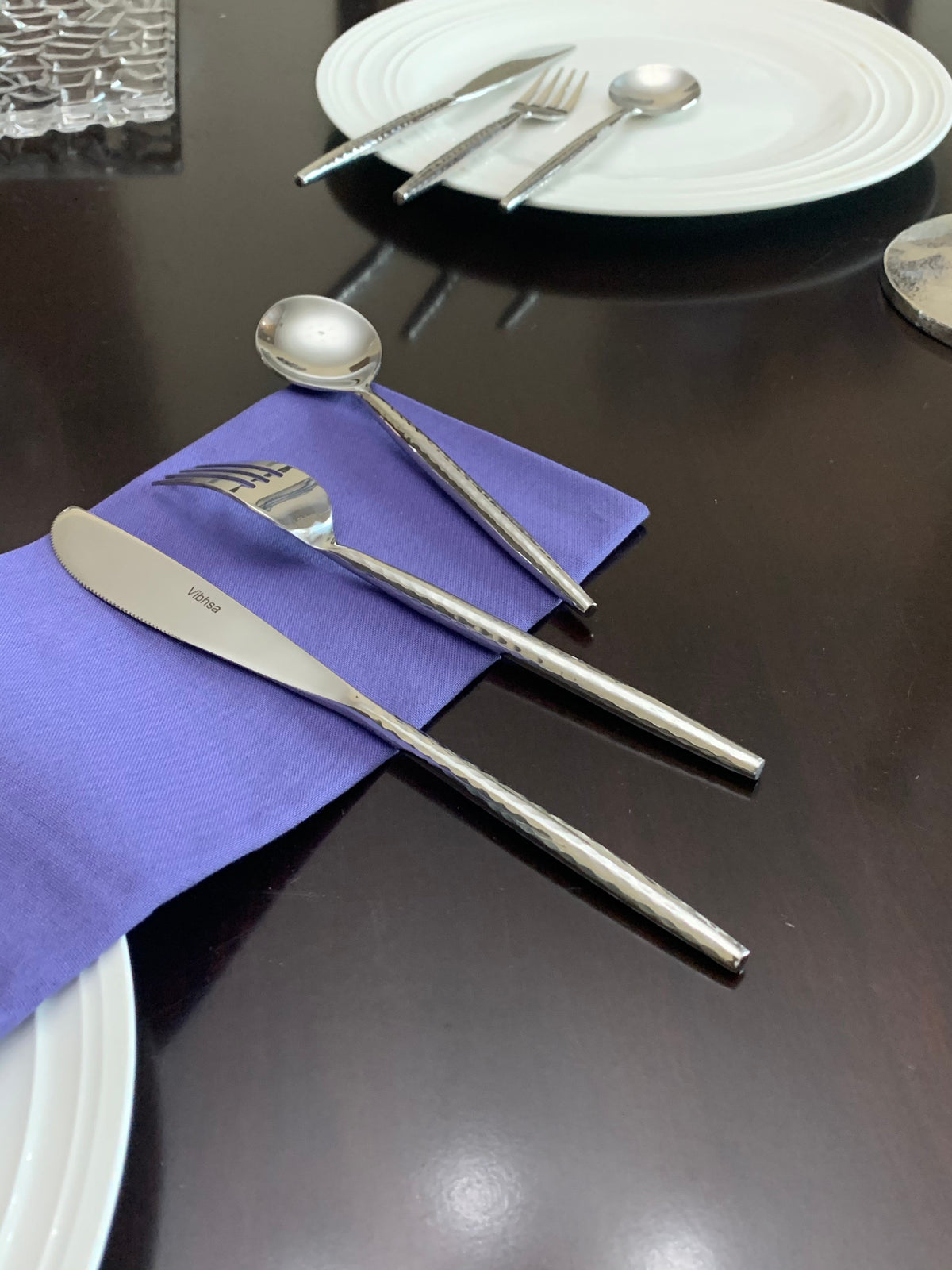 Vibhsa 36-PC Silverware Set for 12; polished stainless flatware with textured handles on napkin on Tampa Home & Garden Store