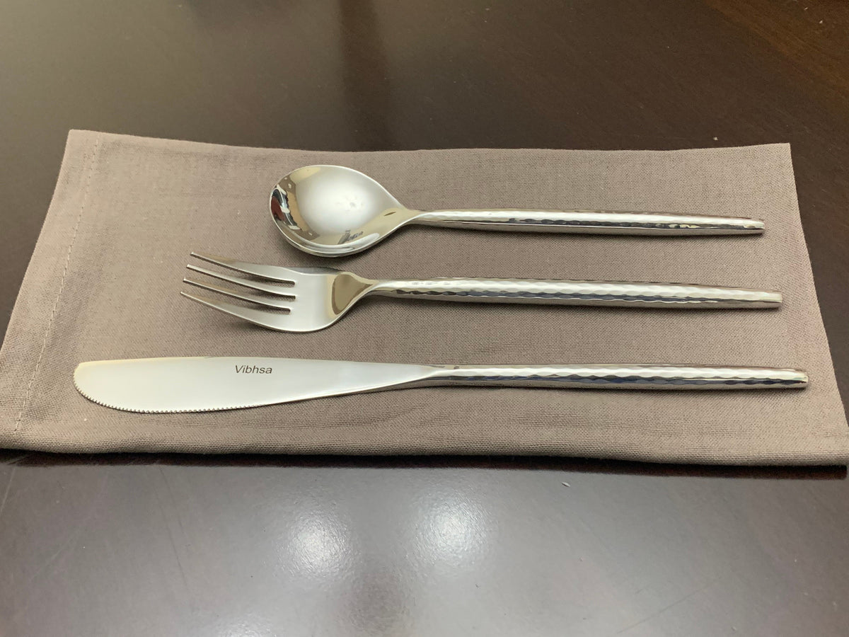 Vibhsa 36-PC silverware set for 12; polished forks spoons knives with hammered handles on napkin on Tampa Home & Garden Store