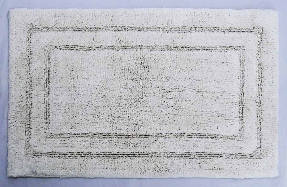 Vibhsa ivory bath rug 20x32 with bordered pattern, plush texture on Tampa Home & Garden Store