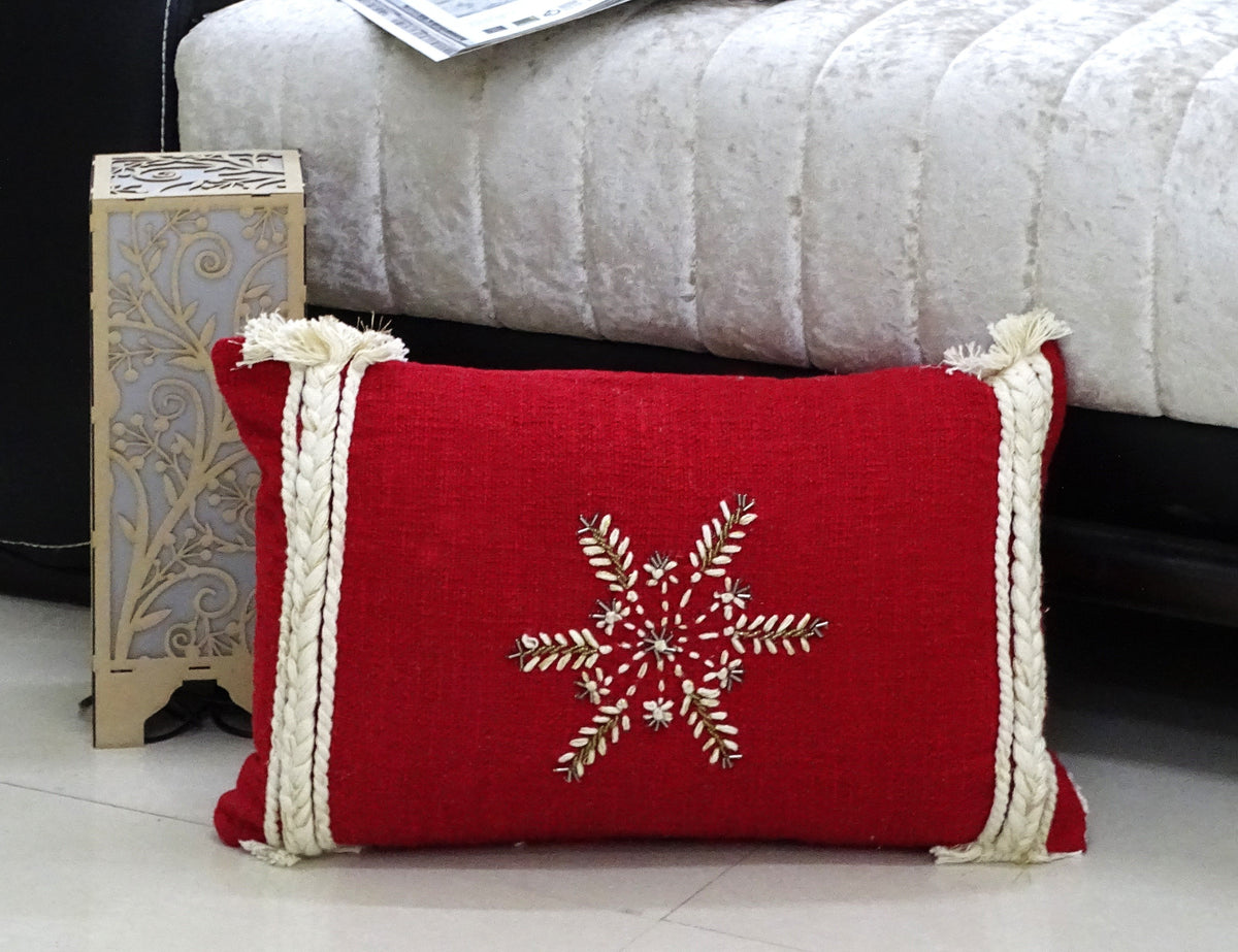 Vibhsa Christmas throw pillow red 14x24 with white snowflake motif and rope trim on edges on Tampa Home & Garden Store