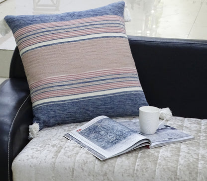 22x22 striped throw pillow with tassels in blue, pink, cream on a black sofa on Tampa Home & Garden Store