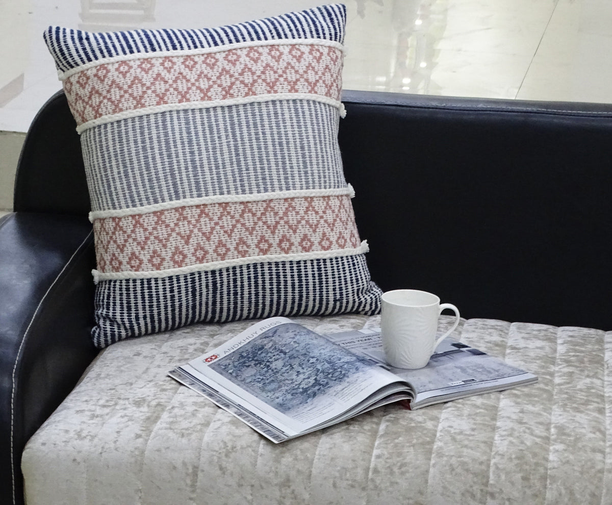 Vibhsa 22x22 decorative throw pillow with navy stripes and pink geometric band rope trim on couch on Tampa Home & Garden Store