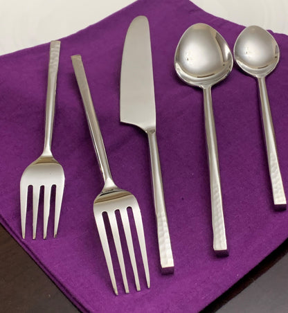 Vibhsa flatware set 20pc service for 4, stainless steel silver forks and spoons on purple fabric on Tampa Home & Garden Store