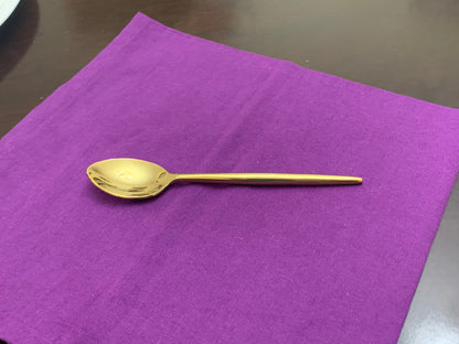 Gold flatware spoon by Vibhsa on purple napkin on Tampa Home & Garden Store