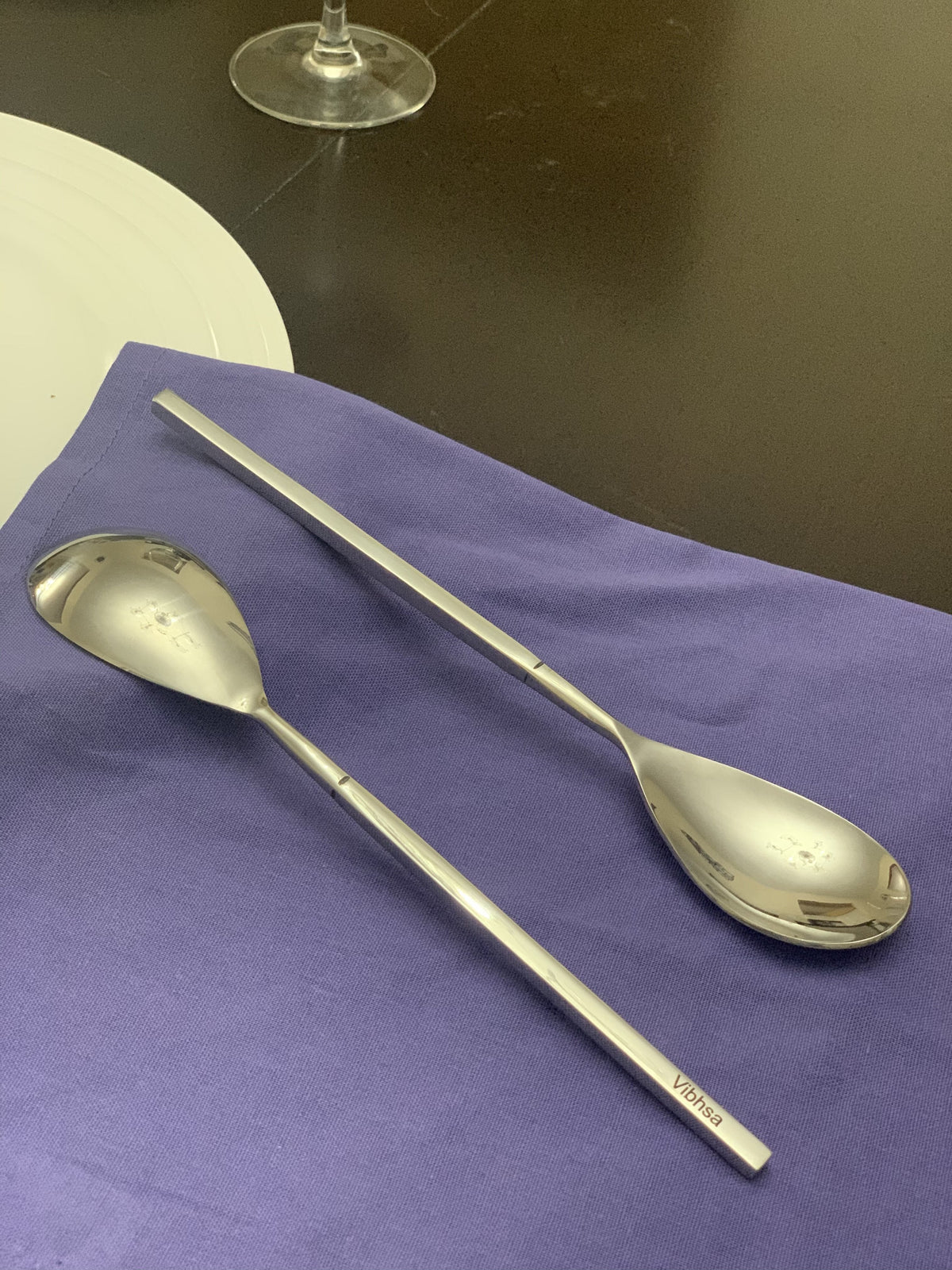 Vibhsa 6-PC stainless steel dinner spoon displayed with a purple napkin beside a white plate and wine glass on Tampa Home & Garden Store