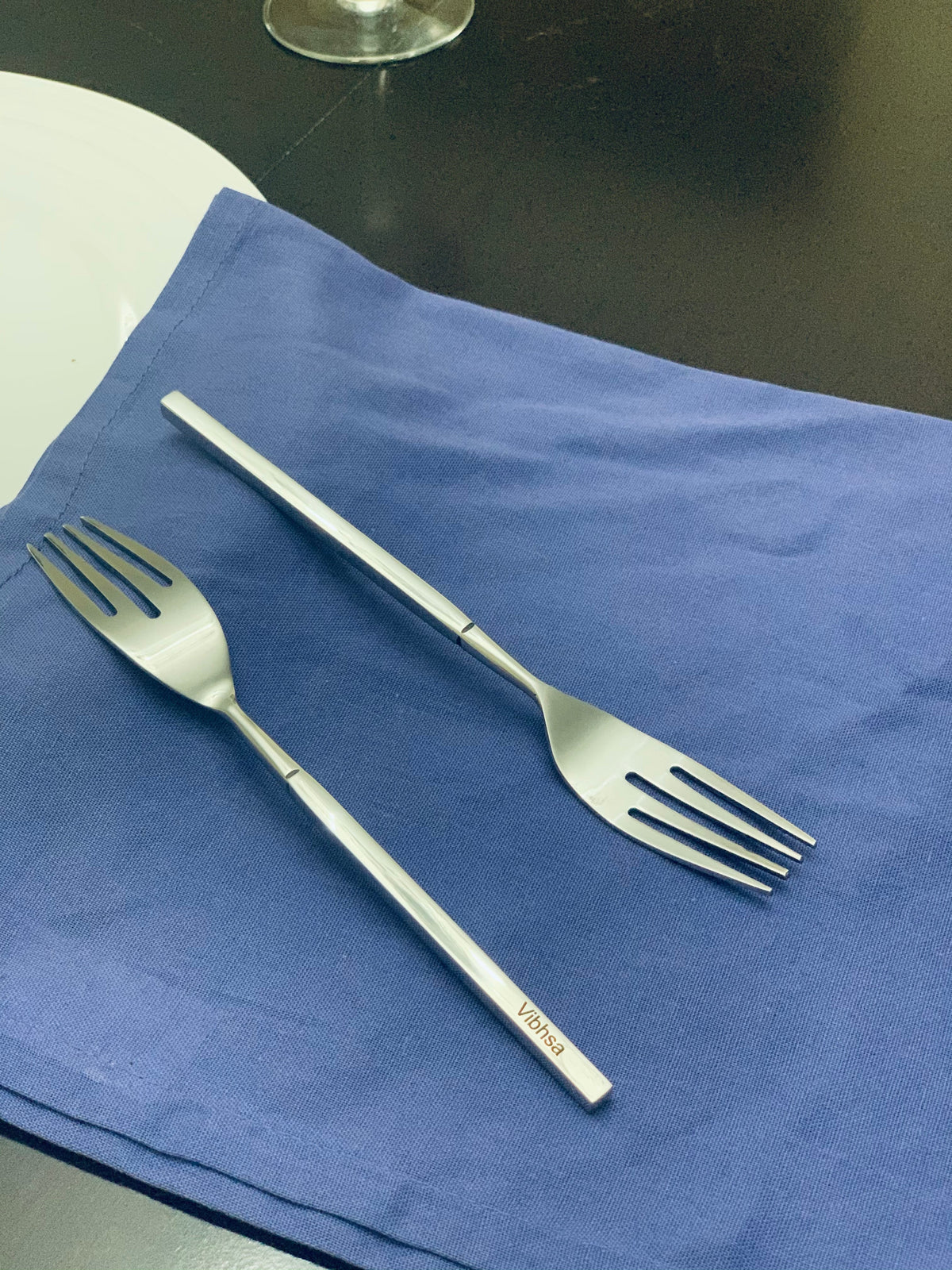 Vibhsa stainless steel salad forks set of 6 on blue napkin on Tampa Home & Garden Store
