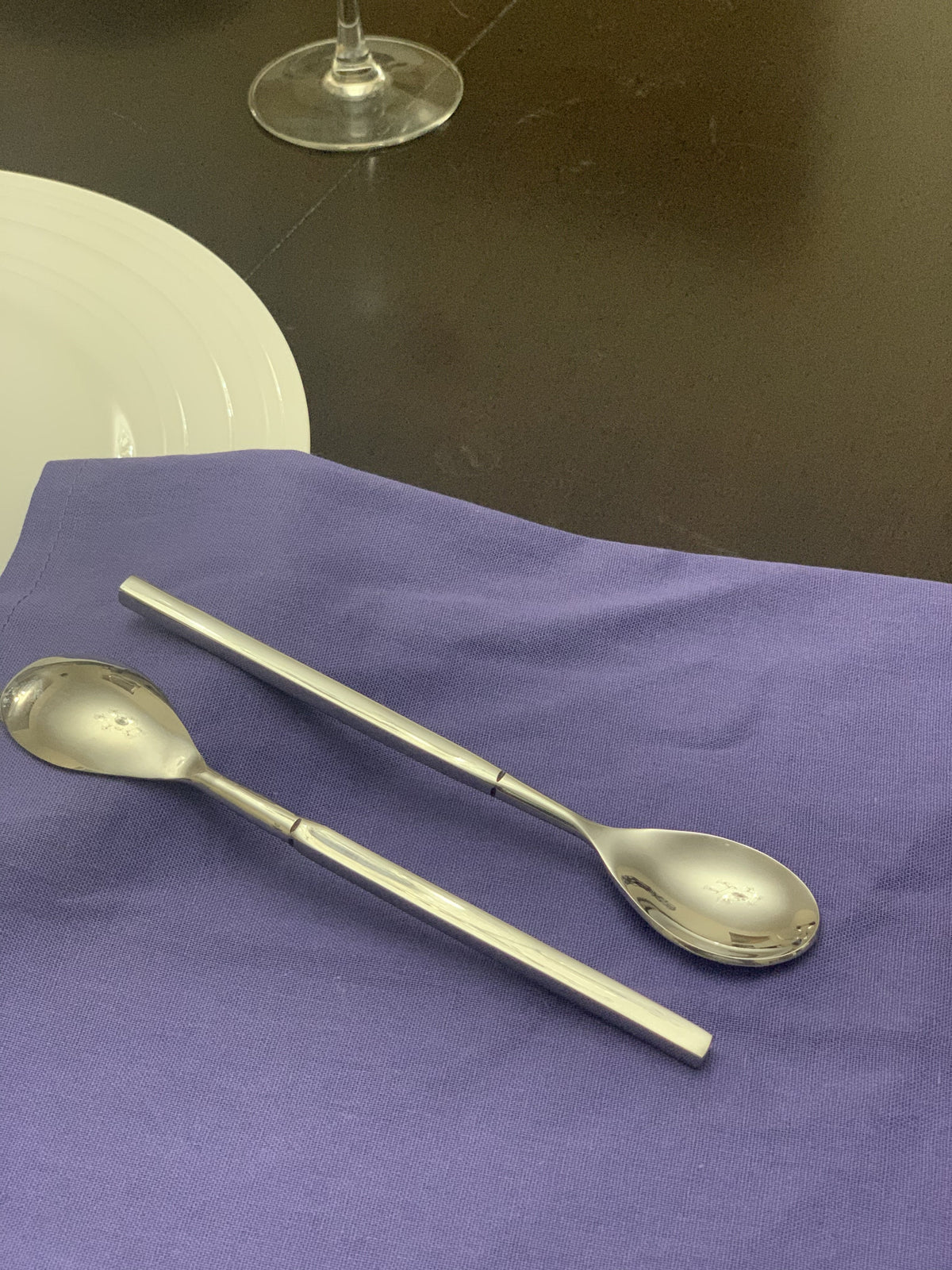 Vibhsa 6-piece stainless steel dessert spoons arranged with a purple napkin and white plate on Tampa Home & Garden Store
