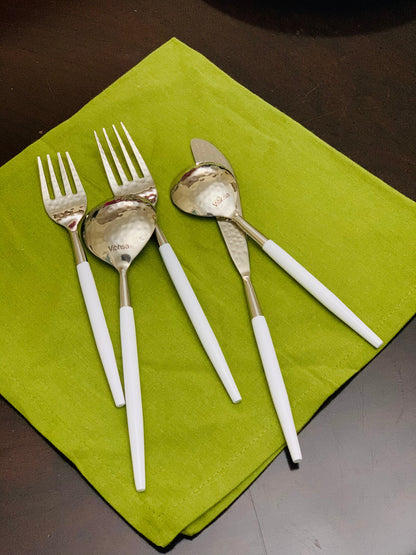 Vibhsa white & silver flatware set of 20 with white handles on green mat on Tampa Home & Garden Store