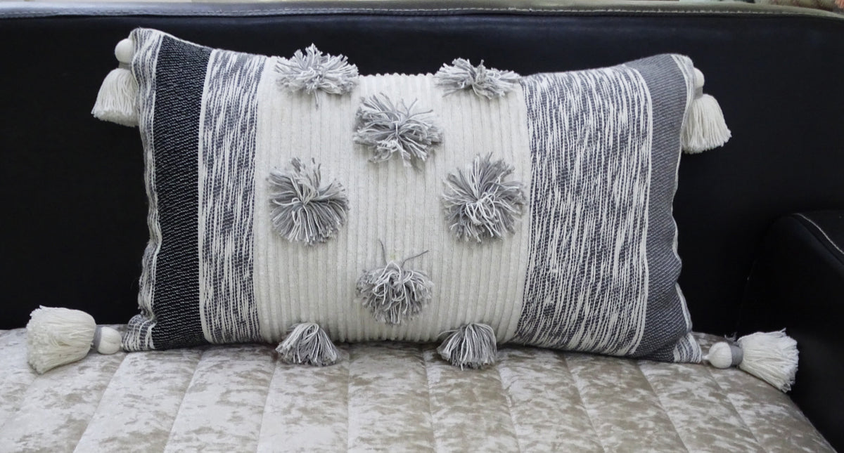 Vibhsa grey melange striped lumbar pillow 14x24 with large pom-poms and tassels on Tampa Home & Garden Store