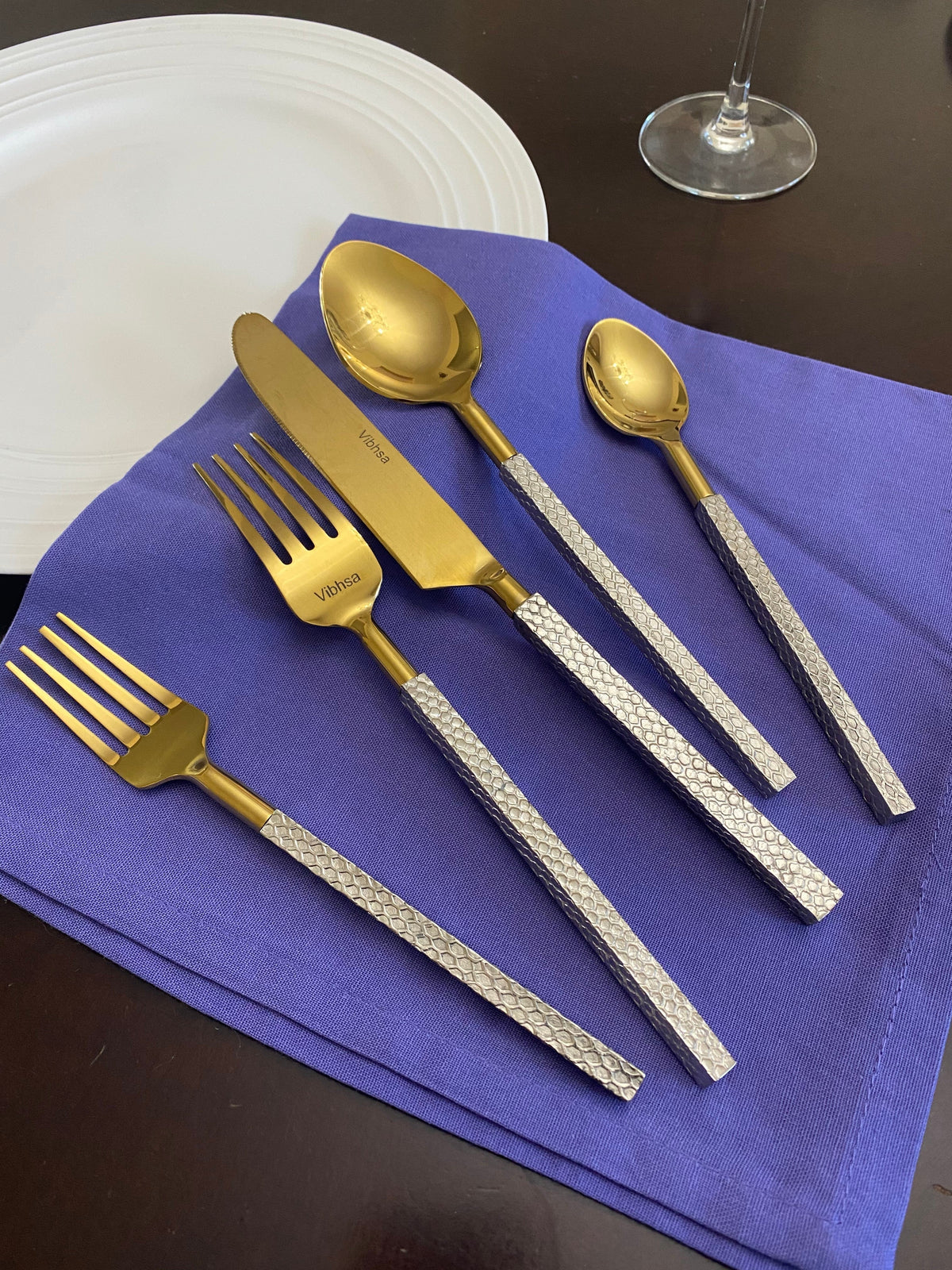 Vibhsa 20pc gold stainless steel flatware set with textured silver handles on Tampa Home & Garden Store
