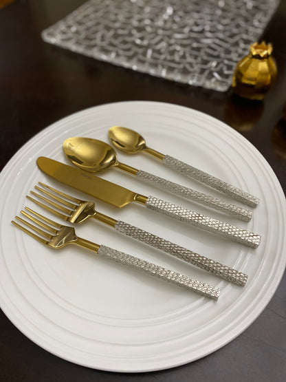 Vibhsa 20pc gold stainless steel flatware set with textured silver handles on a white plate on Tampa Home & Garden Store