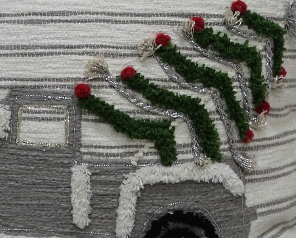 Vibhsa Christmas decorative throw pillow 20x20 with green garland trim and red pom poms on Tampa Home & Garden Store