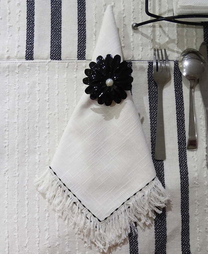 Vibhsa cotton table napkins set of 4 white with subtle weave and a black floral napkin ring on Tampa Home & Garden Store
