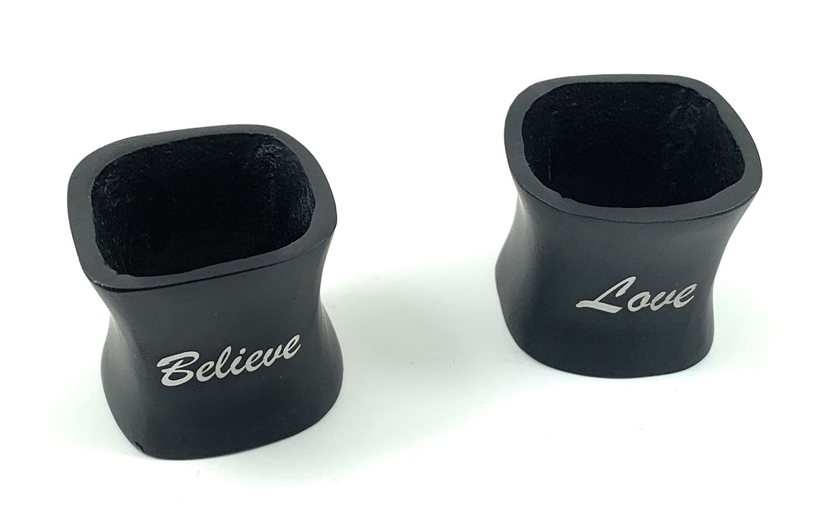 Vibhsa napkin rings set of 4, black boot-shaped rings with white Believe text on Tampa Home & Garden Store