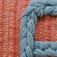Handwoven braid couching decorative pillow orange base with blue braided trim Vibhsa 14x24 on Tampa Home & Garden Store