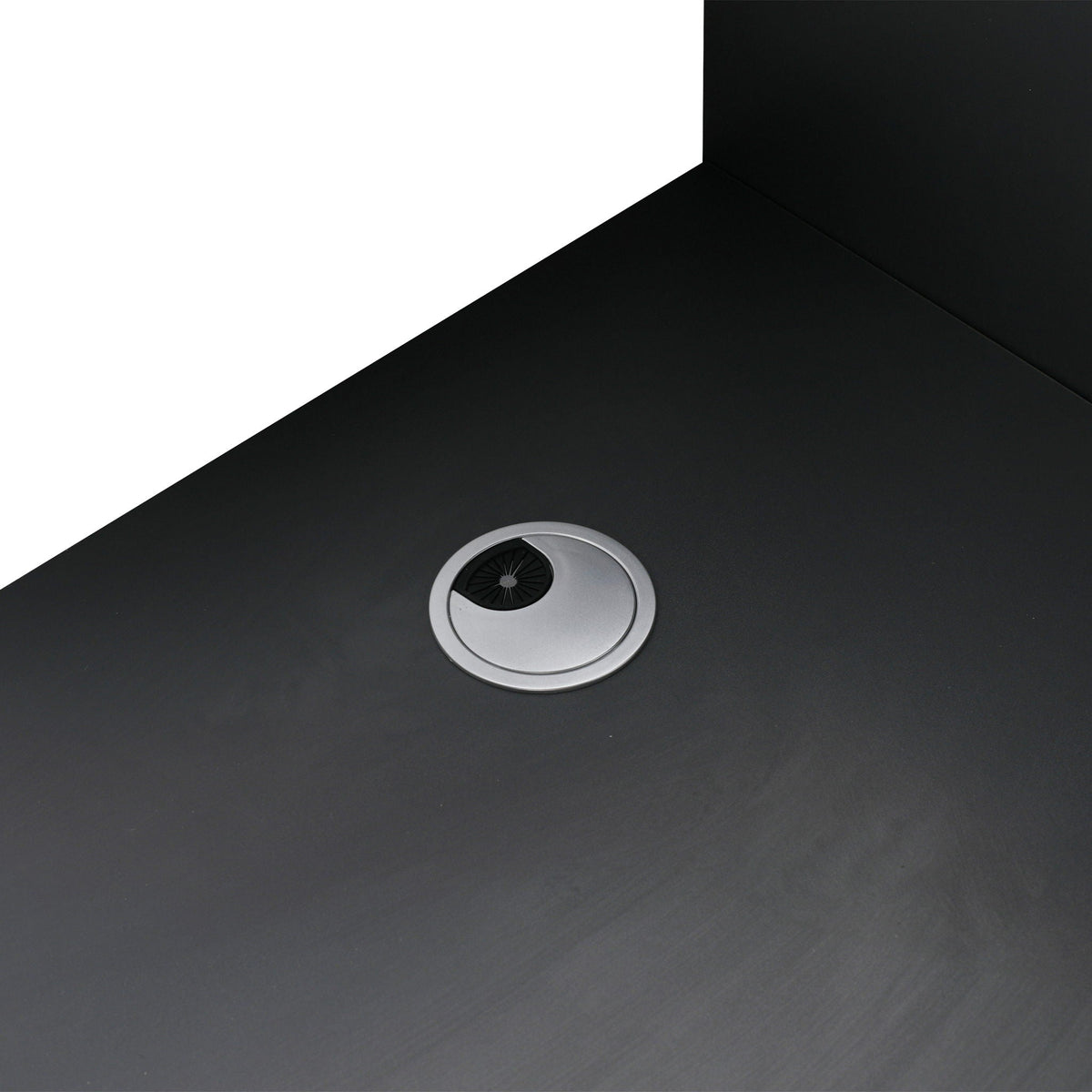 Freestanding bath vanity surface in black with circular silver drain on Tampa Home & Garden Store