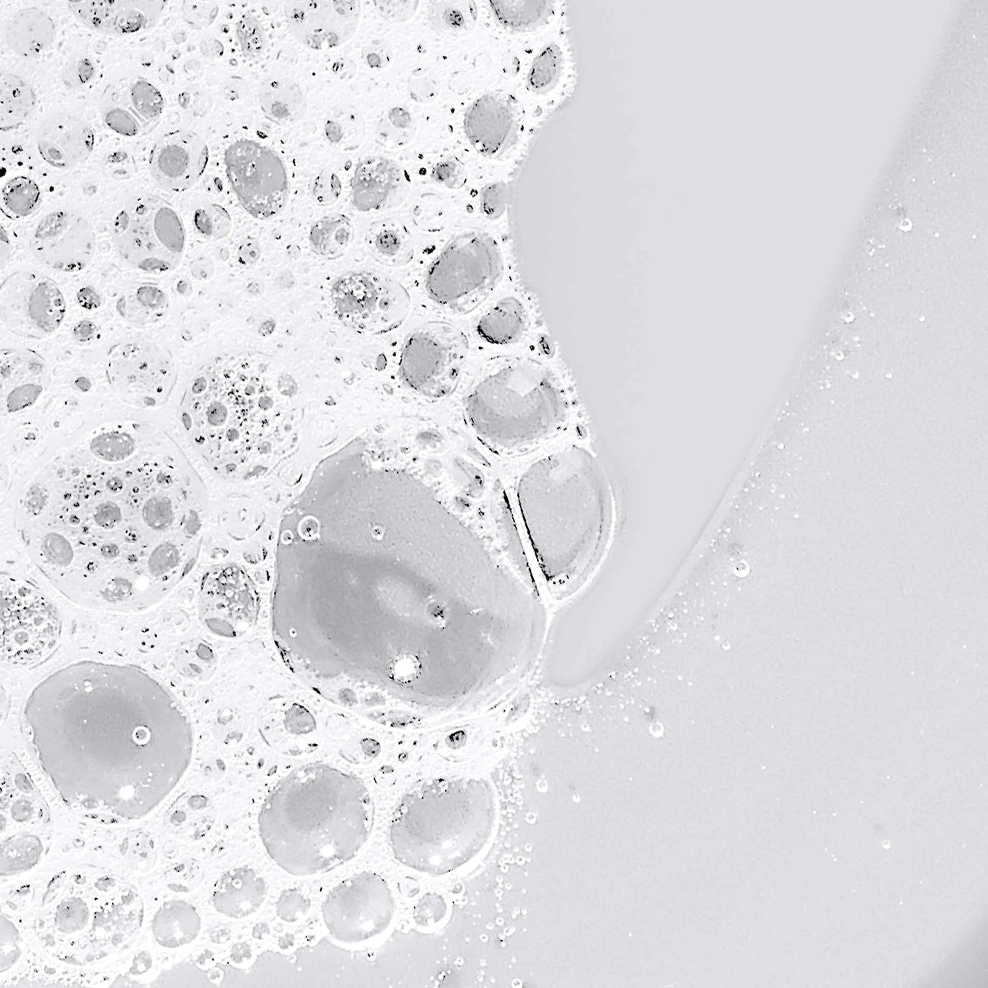 Dermalogica Conditioning Body Wash foam with lavender tea tree, white bubbly lather on surface on Tampa Home & Garden Store
