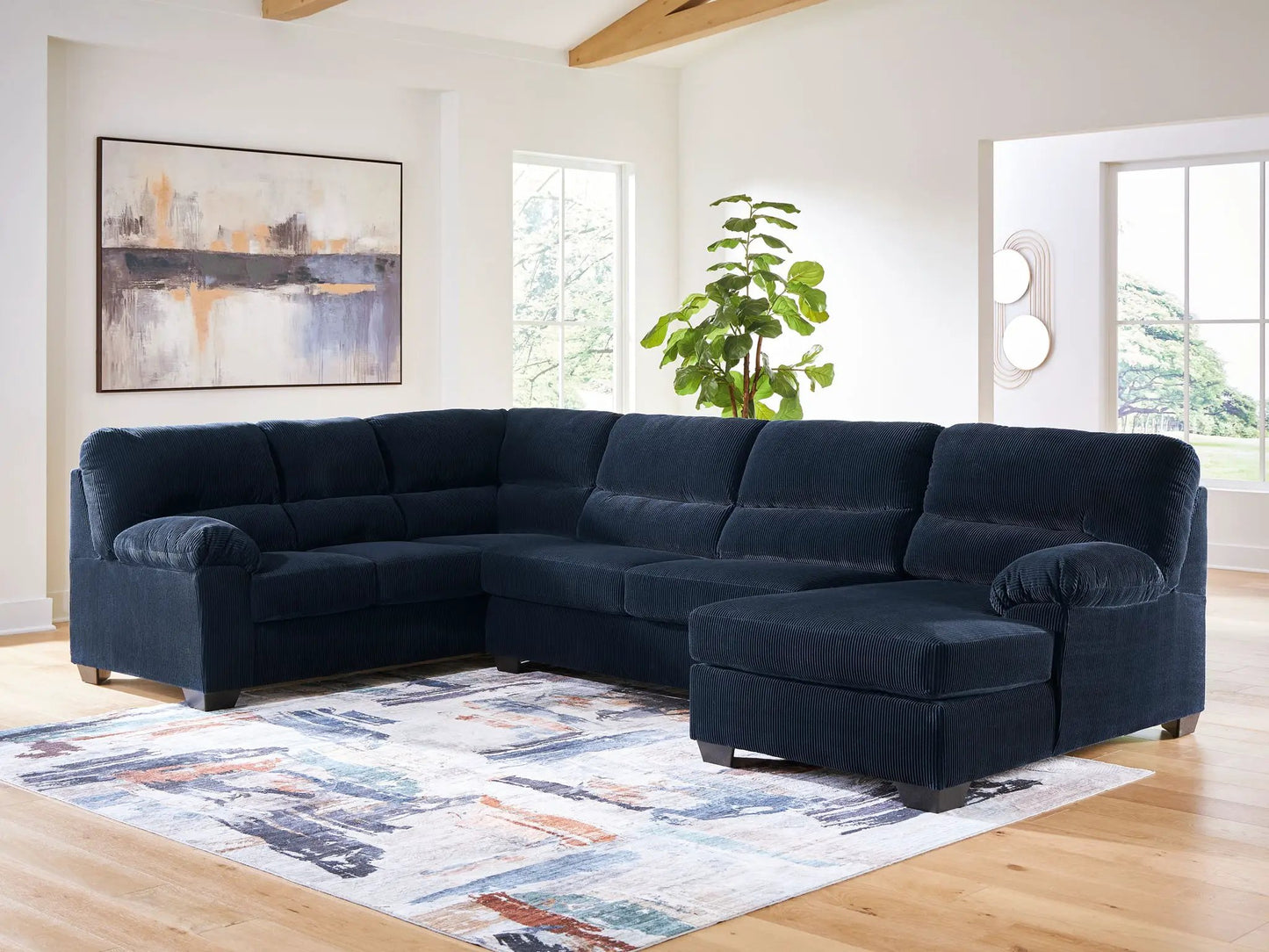 SimpleJoy - Sectional by Unique Piece Furniture in navy blue fabric stationary sofa with plush cushions on Tampa Home & Garden Store