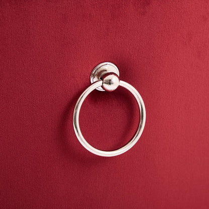 Chrome circular towel ring mounted on burgundy textured wall on Tampa Home & Garden Store