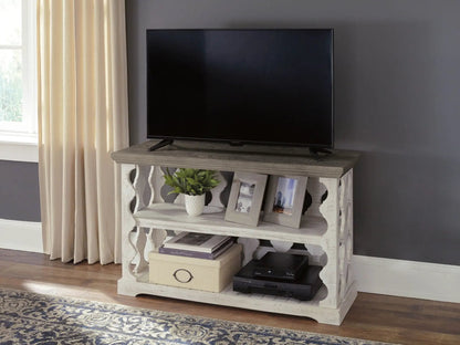 Havalance console sofa table gray/white by Unique Piece Furniture with TV on top and frames on shelf on Tampa Home & Garden Store