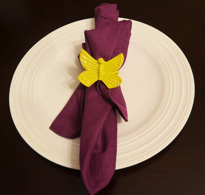 Vibhsa butterfly napkin ring aluminum, yellow, secures purple napkin on white plate on Tampa Home & Garden Store