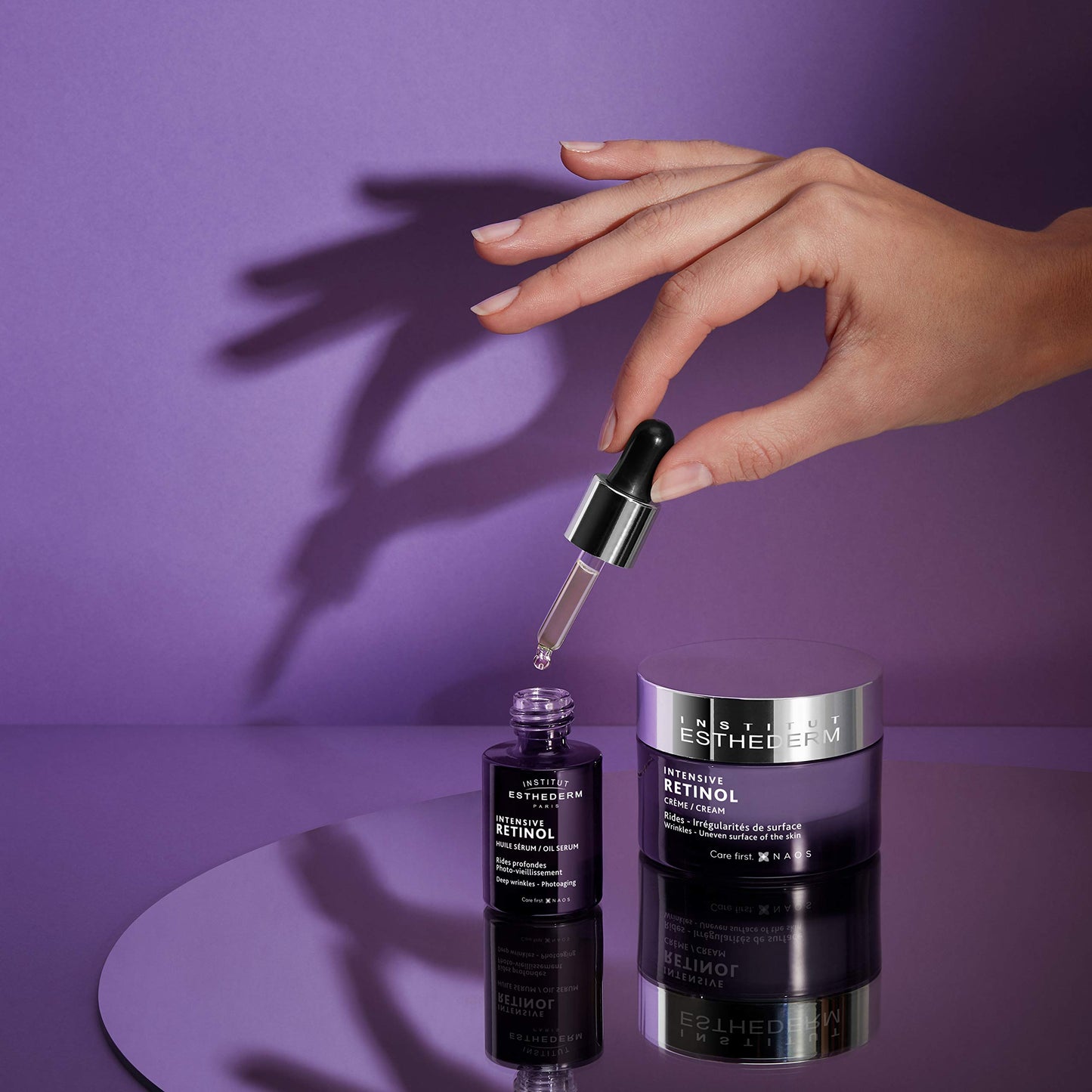 Esthederm Intensive Retinol face cream and serum bottles on purple background on Tampa Home & Garden Store