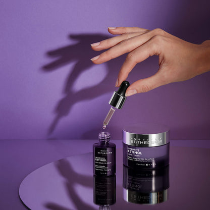 Esthederm Intensive Retinol face cream and serum bottles on purple background on Tampa Home & Garden Store