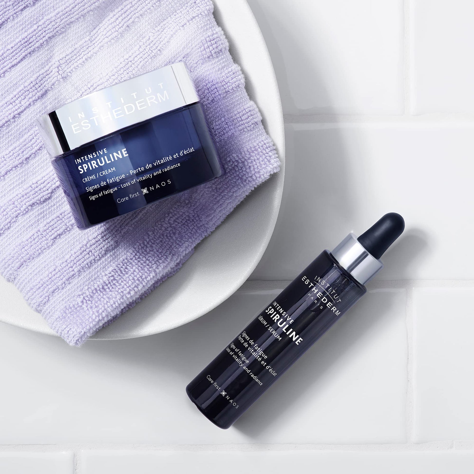 Face cream Esthederm Intensive Spiruline jar and serum bottle on lavender towel on Tampa Home & Garden Store