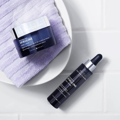 Face cream Esthederm Intensive Spiruline jar and serum bottle on lavender towel on Tampa Home & Garden Store