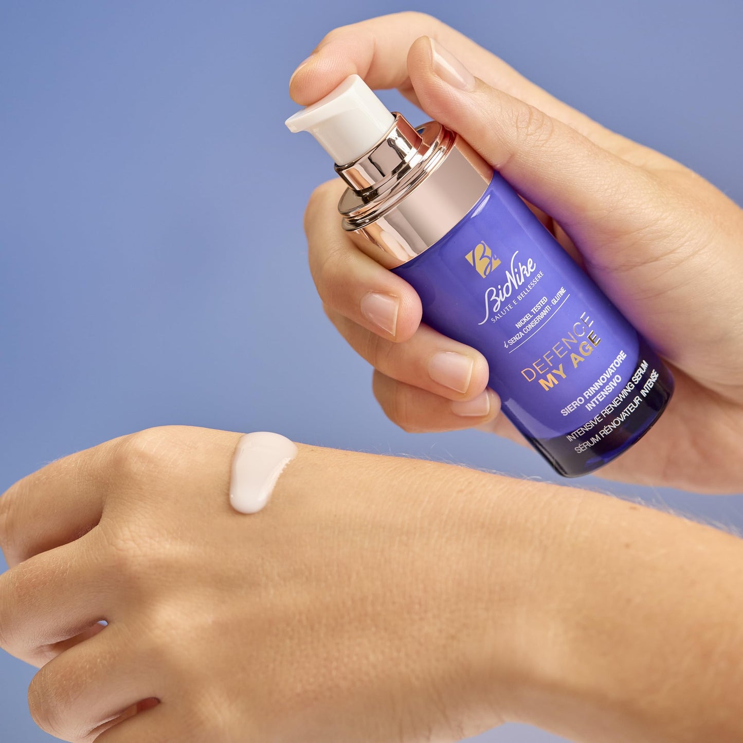 BioNike Defence My Age Renewing Serum bottle with white pump on purple bottle, gold lettering on Tampa Home & Garden Store