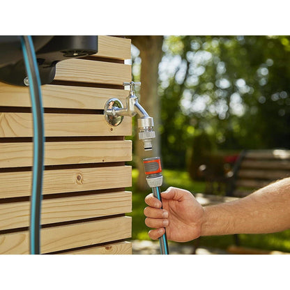 Wall-Mounted Hose Box RollUp XL 35m Gardena with chrome faucet and blue hose on wooden wall on Tampa Home & Garden Store