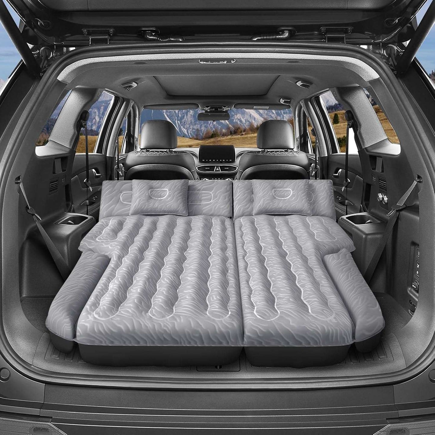 Dikasun Outdoor SUV mattress 63in extended, grey, inflated inside SUV with pillows on Tampa Home & Garden Store