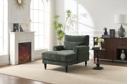 Chaise lounge recliner in green upholstery in a sunlit living room with fireplace on Tampa Home & Garden Store