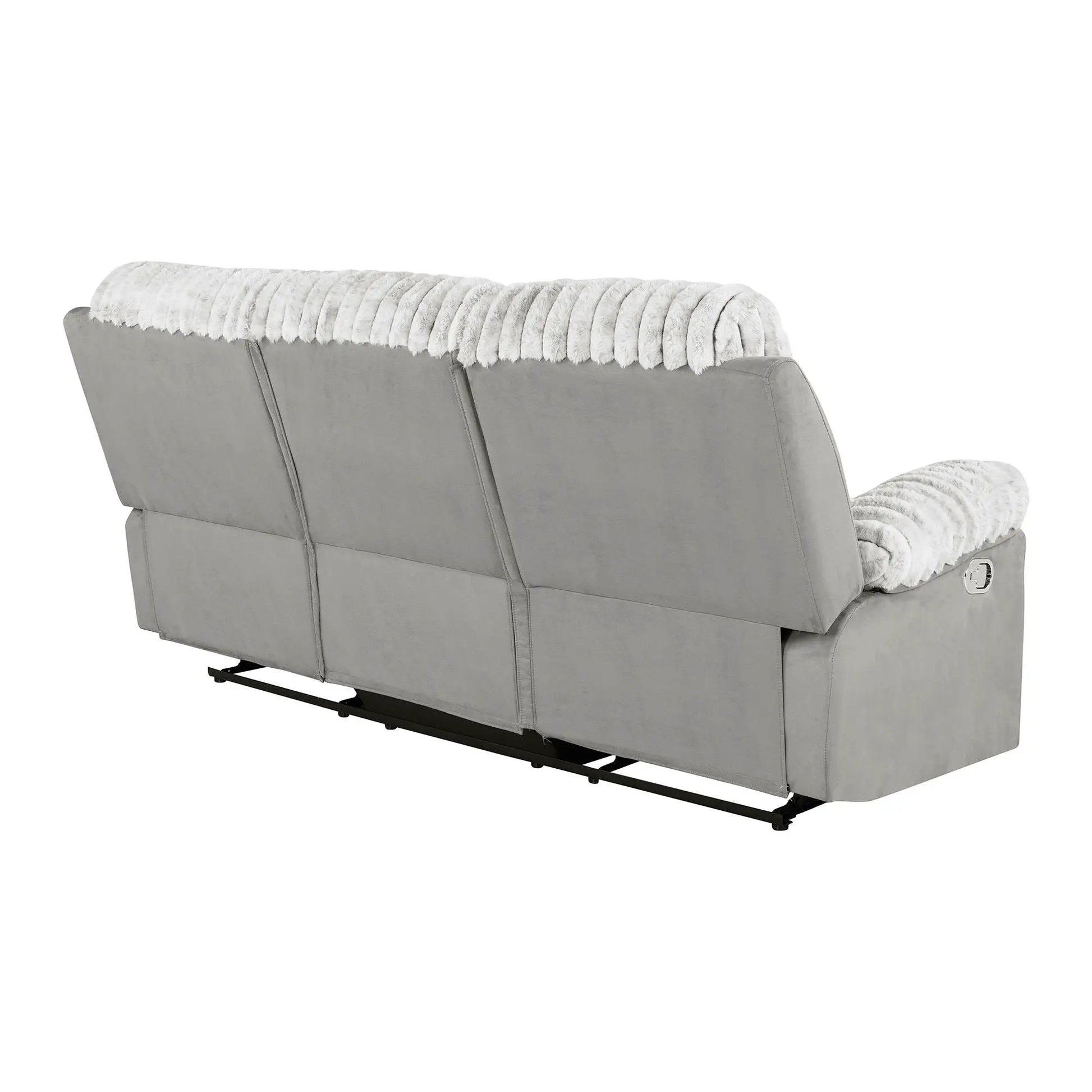 Brenda reclining sofa with manual recline in gray upholstery and a white faux fur throw on Tampa Home & Garden Store