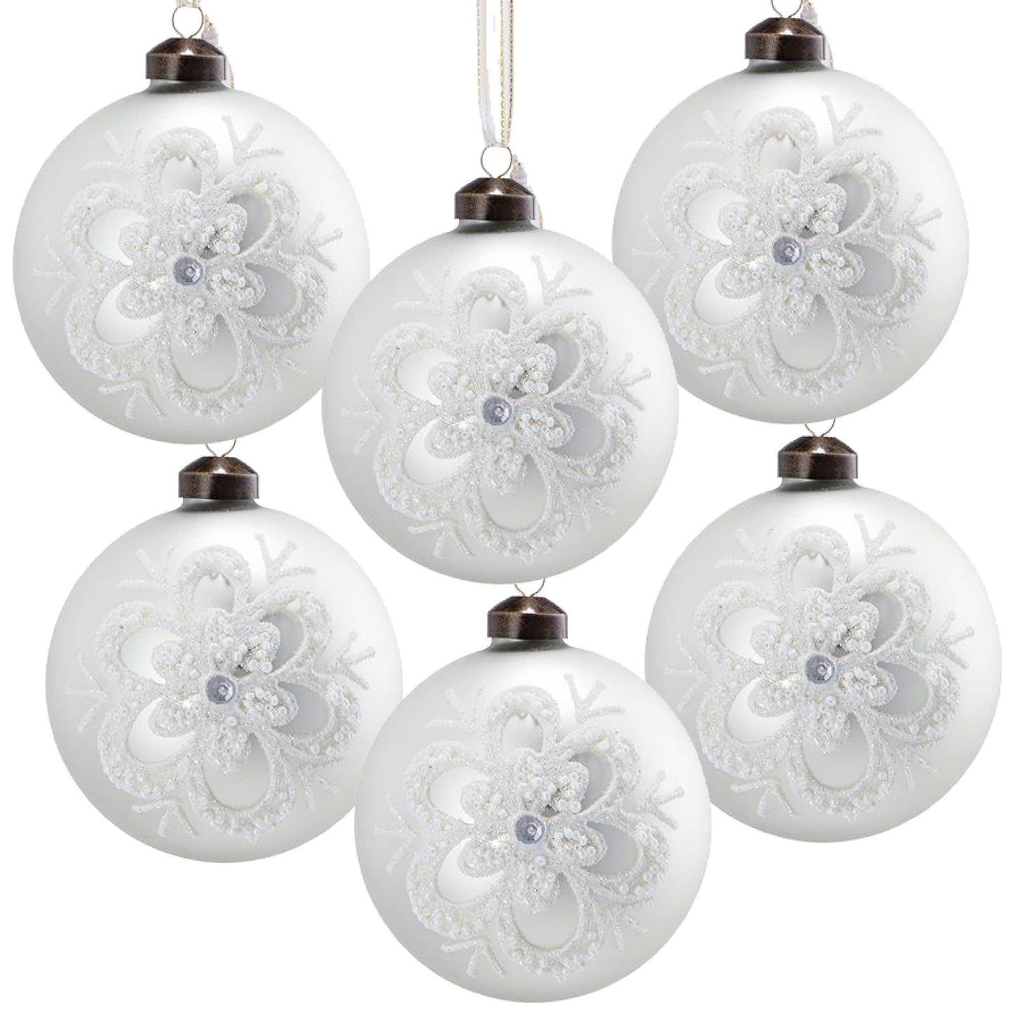 White glass Christmas ball ornaments with embossed glitter lace snowflake pattern, hanging from bronze caps on Tampa Home & Garden Store
