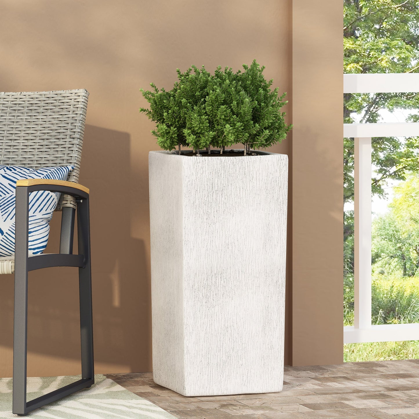 MGO Planter by HouseOfZazla, white textured planter with lush green shrub on Tampa Home & Garden Store