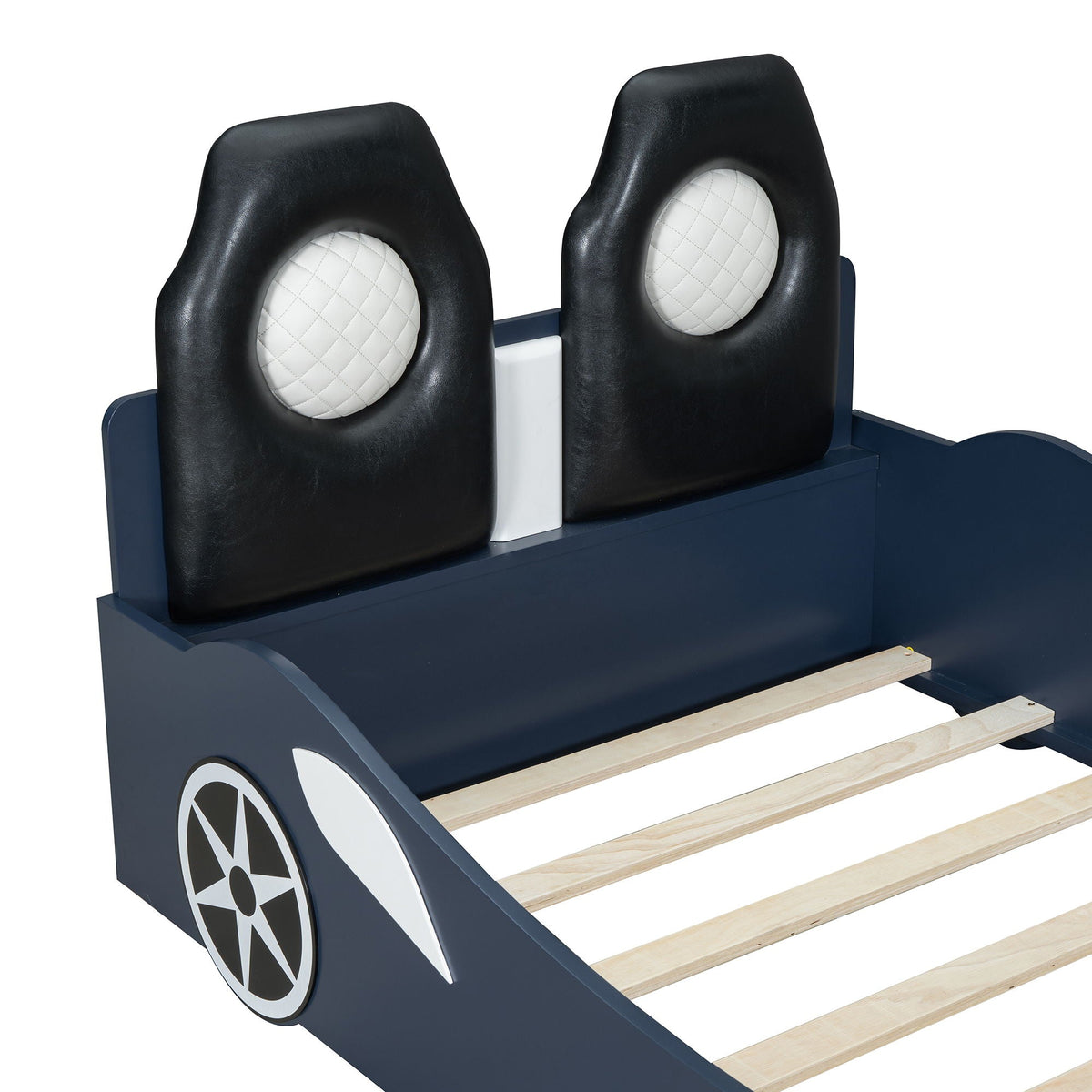 Race car shaped platform bed with two black upholstered backrests, white quilted inserts on Tampa Home & Garden Store