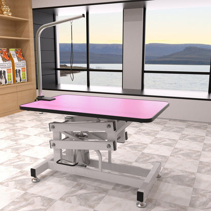 Hydraulic pet grooming table with pink non-slip top and gray metal frame on Tampa Home & Garden Store