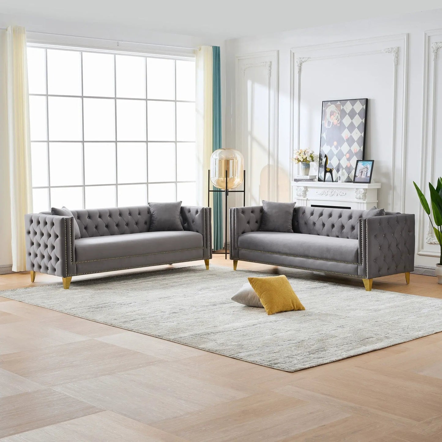 Pair of deep-seat gray tufted sofas with button nailhead and square arms, brass legs on Tampa Home & Garden Store