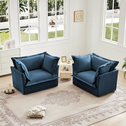 Set of 2 navy blue slipcovered armchairs by HouseOfZazla in a bright sunlit living room on Tampa Home & Garden Store