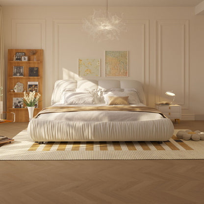 Luxury upholstered platform bed with oversized padded backrest in warm beige fabric on Tampa Home & Garden Store
