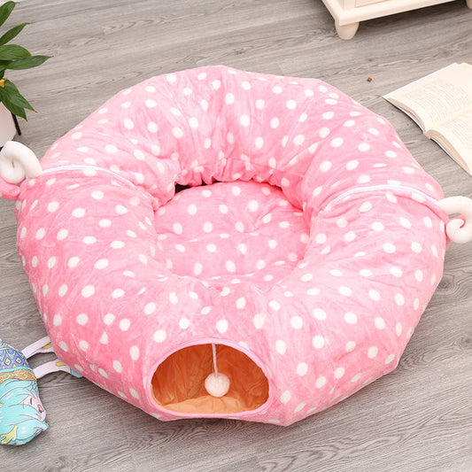 Pink plush cat tunnel sleeping nest, donut shape with white polka dots and orange interior on Tampa Home & Garden Store