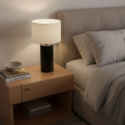 Aura table lamp with on/off switch, black block base and white fabric shade on nightstand on Tampa Home & Garden Store