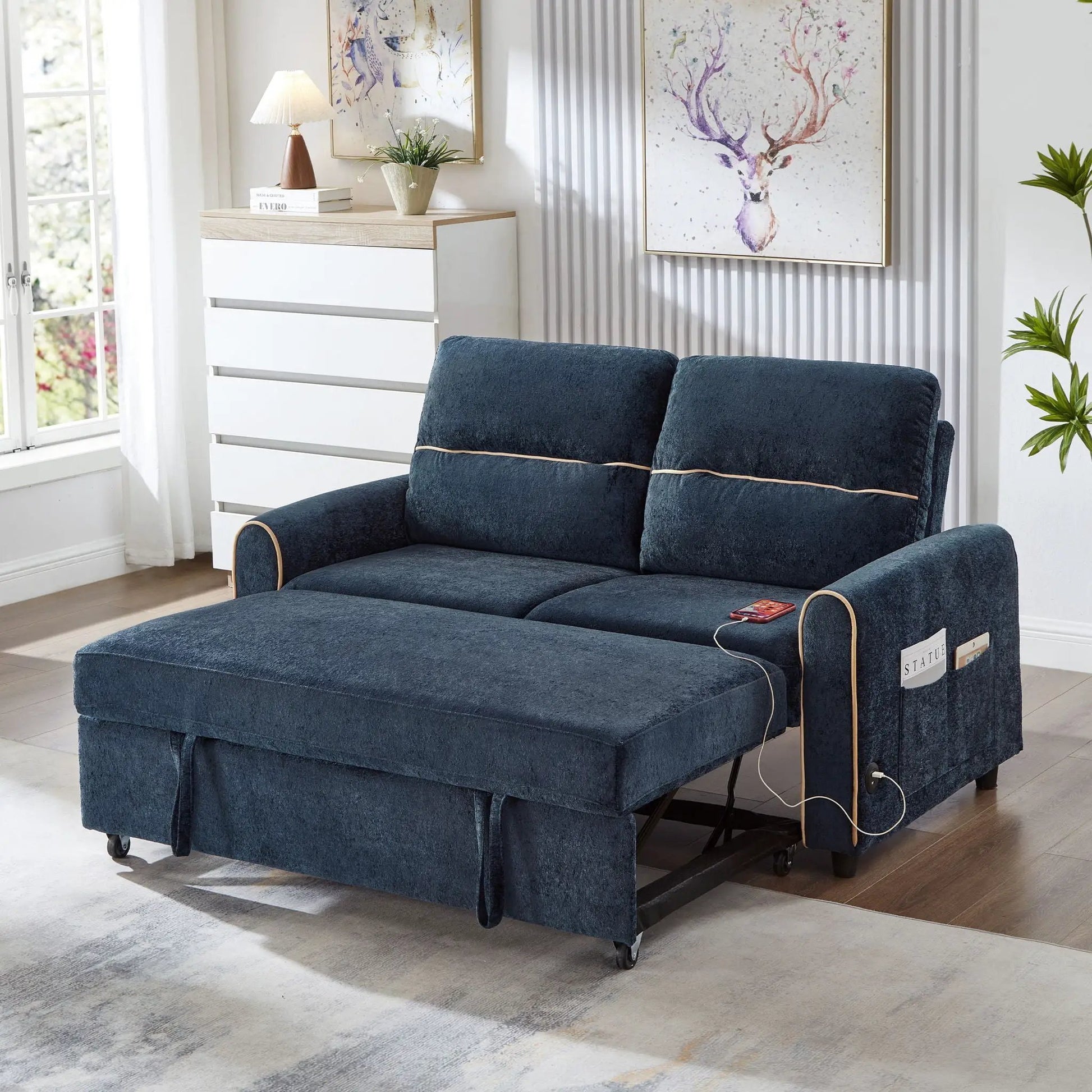Sleeper loveseat in navy velvet with pull-out bed, adjustable backrest, USB ports, side pockets on Tampa Home & Garden Store