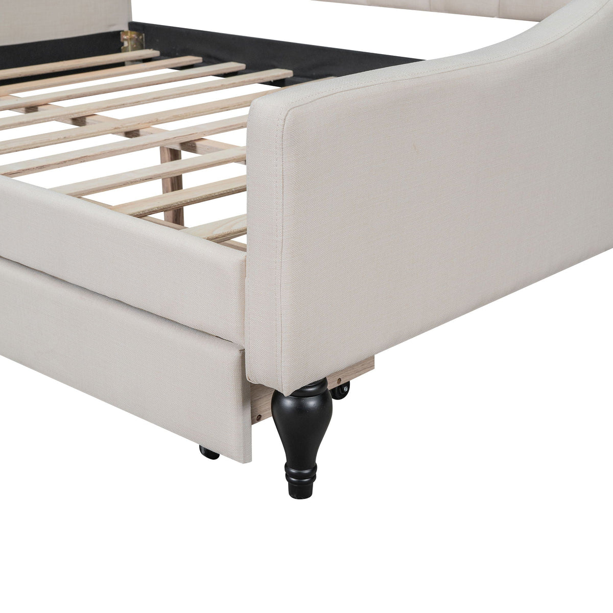 Upholstered daybed by HouseOfZazla with beige fabric, wood slat base, and black turned legs on Tampa Home & Garden Store